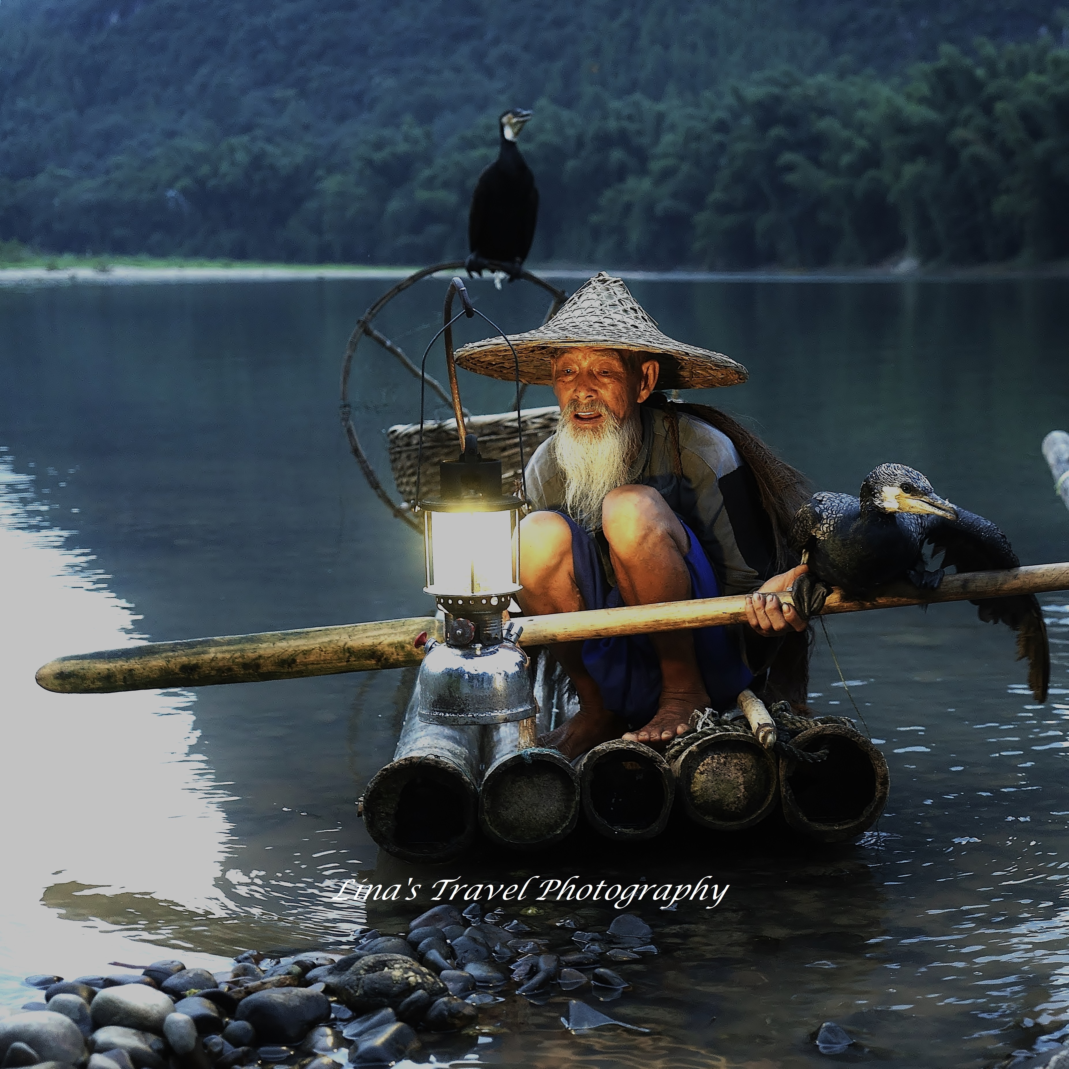 Cormorant fishermen, Mr Huang Quande 88 years old, at Li River in Yangshuo Guangxi China